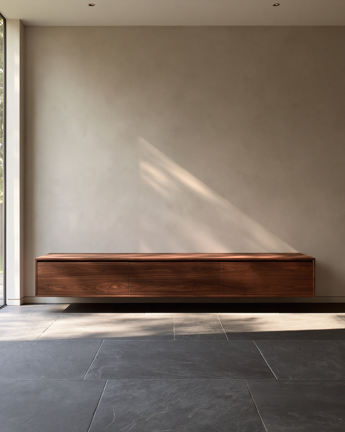 Walnut sideboard against a warm grey plaster wall, artwork shown to scale