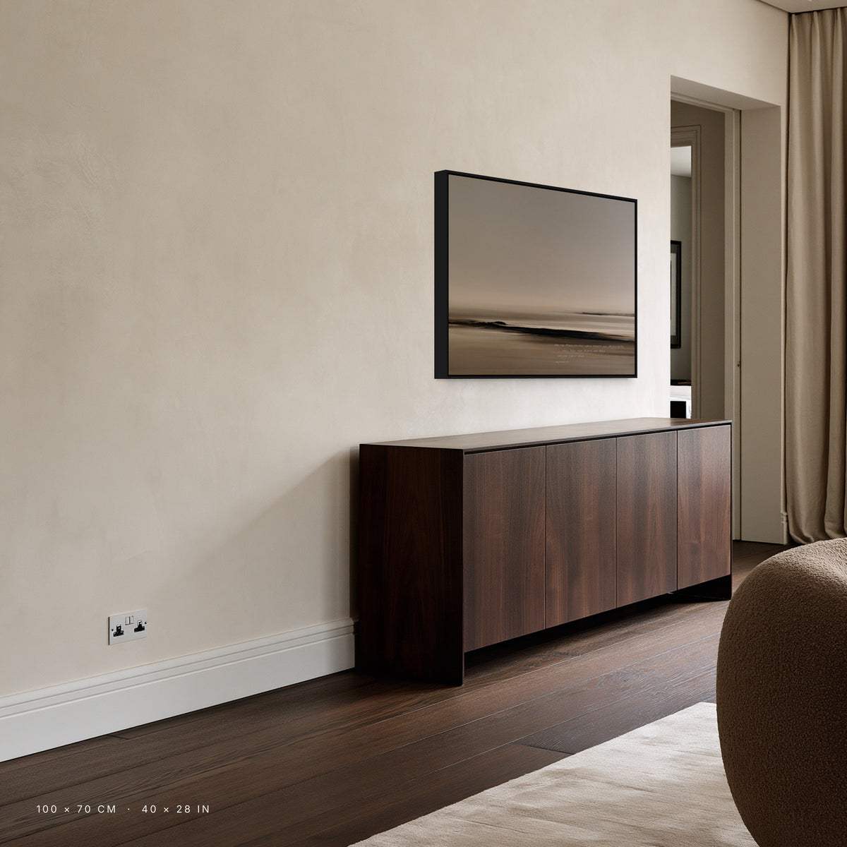 Ebb canvas, 100 x 70 cm, black floating frame, above a sideboard in a living room