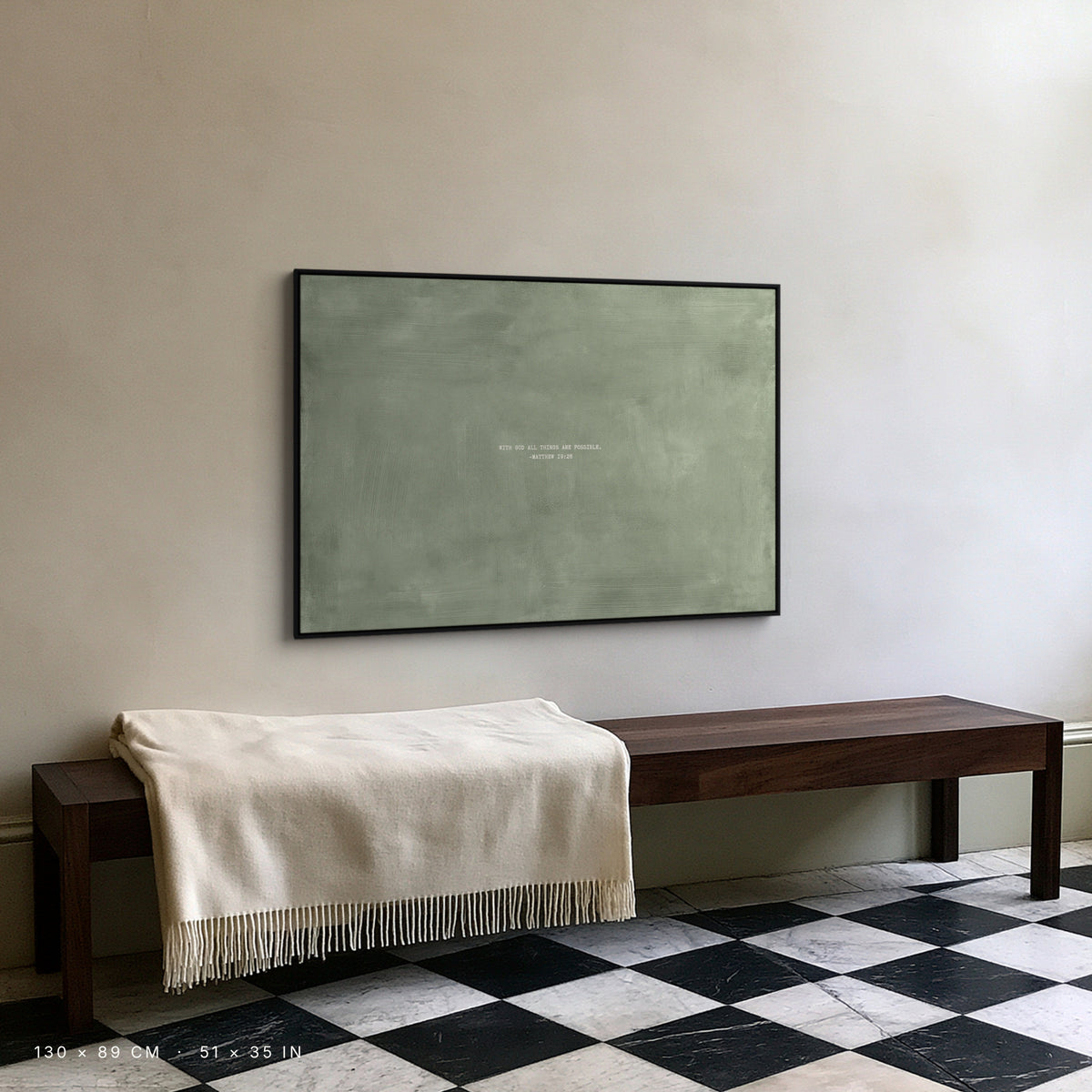 Sage canvas, 130 × 89 cm, black floating frame, above a walnut bench in a London entrance hall