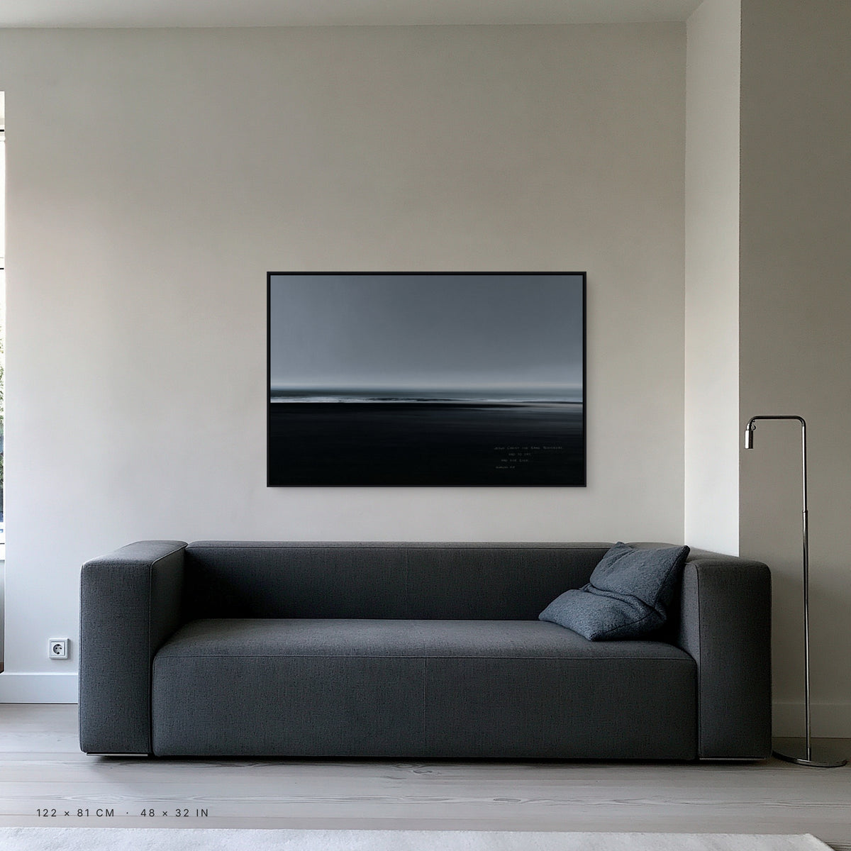 Slate canvas, 122 x 81 cm, black floating frame, above a sofa in a living room